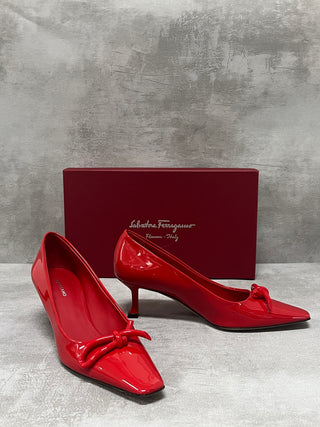 Red "Annie" Bow-Embellished Patent Pumps