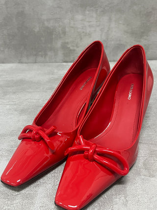 Red "Annie" Bow-Embellished Patent Pumps