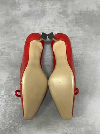 Red "Annie" Bow-Embellished Patent Pumps