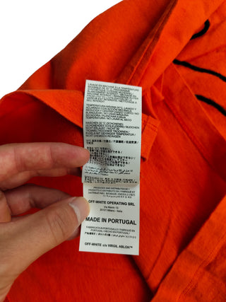 Orange Tee With Black Stitching Logo At The Back