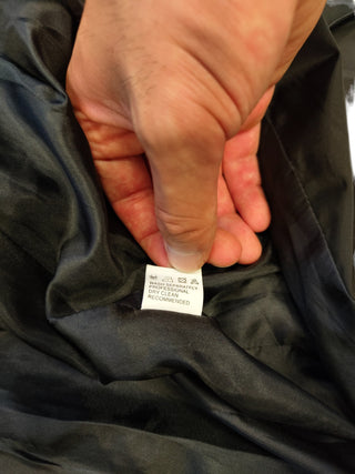 Black Trench Coat With Beige Print At The Bottom And A Matching Belt Strap