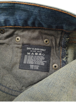 Blue Jeans With Studded Logo Detail At The Back