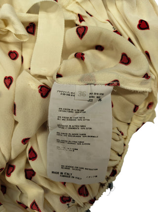 Beige Dress With Overall Heart Shaped Pattern And Open Back