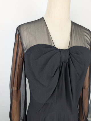 Black Dress With Sheer Sleeves And Ribbon At The Front