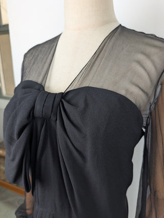 Black Dress With Sheer Sleeves And Ribbon At The Front