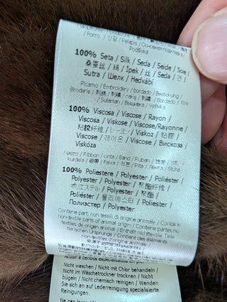 Brown Fur Vest With Blue Fur Frims And Logo Back Belt