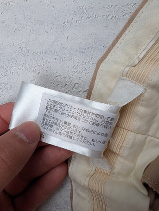 Beige Cotton And Linen Pants With Metal Clasp Closure And Slight Elastic Band At The Back