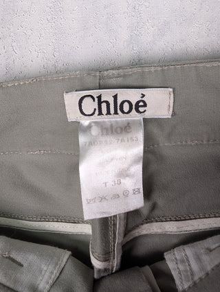 Washed Green Jeans With Stitching Details And Logo Button