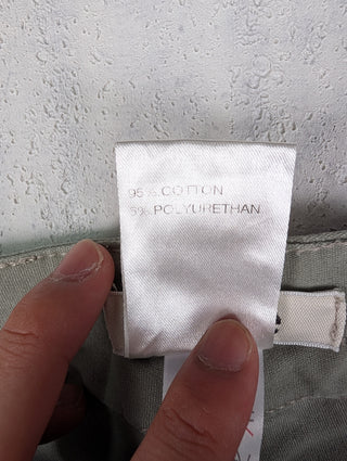 Washed Green Jeans With Stitching Details And Logo Button