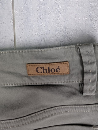 Washed Green Jeans With Stitching Details And Logo Button