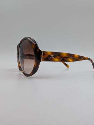 Brown Tortoise Round Sunglasses With Quilted Arms And Small Interlocking CC Logo On Side Arms