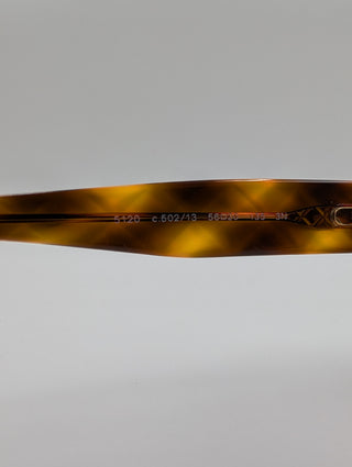 Brown Tortoise Round Sunglasses With Quilted Arms And Small Interlocking CC Logo On Side Arms
