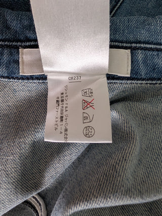 Vintage Inspired Washed Blue Denim Button Down Dress With Logo Embossed Buttons And Zip-Closure Chest Pockets