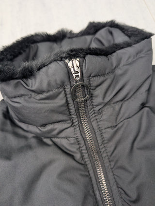Black Puffer Vest Features Fur Trim On Collar And Circular Zipper Pull