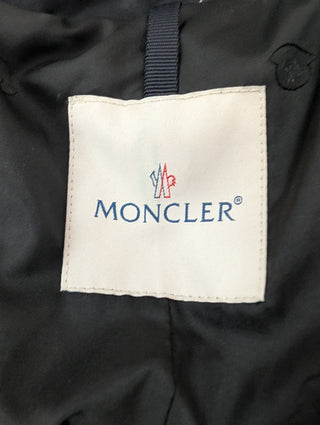 Black Puffer Vest Features Fur Trim On Collar And Circular Zipper Pull