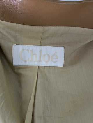 Tan Collarless Short Leather Jacket With Hook-Eye Clasps For Front Closure