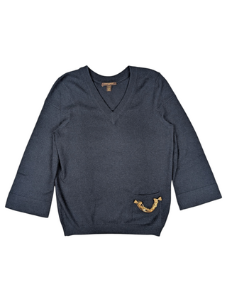 Navy V-Neck Cashmere Sweater Ffeatures A Golden Brooch With Bow Charms On A Lower Left Pocket