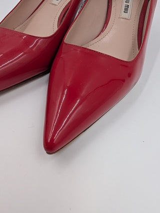 Red Patent Leather Point-Toe Heels With Bedazzled Sole