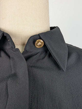 Black Button Up Top With Shoulder Pads And Gold Button At Top