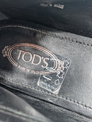 Black Snakeskin Flats With Metal Logo Details