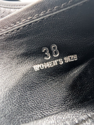 Black Snakeskin Flats With Metal Logo Details