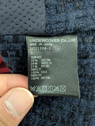 Now From Then Undercover navy cotton blend jacket care label showing fabric composition and Japanese manufacturing